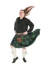 Scottish man in traditional national costume with blowing kilt Royalty Free Stock Photo