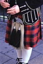 Scottish man wearing kilts playing the bagpipes. Royalty Free Stock Photo
