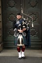 Scottish piper playing his bagpipe. Royalty Free Stock Photo