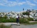 Scottish Piper Playing Bagpipes at Peggy`s Cove, Nova Scotia Royalty Free Stock Photo