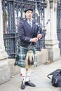 Scottish piper in traditional costume