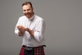 Happy Scottish redhead man in red