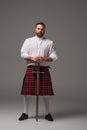 Scottish redhead man in red kilt