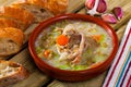 Scottish soup with lamb, vegetables, pulses, barley in clayware Royalty Free Stock Photo