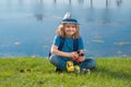 Scout boy wearing explorer hat and backpack outdoor. Explorer and adventure with binocular. Royalty Free Stock Photo