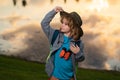 Scout boy wearing explorer hat and backpack outdoor. Explorer and adventure with binocular. Royalty Free Stock Photo