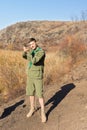 Scout leader taking a compass sighting Royalty Free Stock Photo