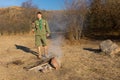 Scout or ranger making a cooking fire