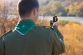 Scout taking a sighting with his compass Royalty Free Stock Photo