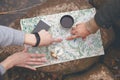 Scout tourists plan the route, orientate on the terrain on the map and the compass. View from above Royalty Free Stock Photo