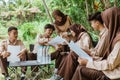 Scout youth members work together on paper assignments