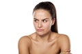 Scowling woman without makeup