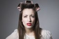 Scowling Young Female With Hair Rollers And Red Lipstick