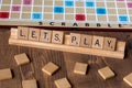 Scrabble board game with the scrabble tile spell `Lets Play` Royalty Free Stock Photo