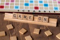 Scrabble board game with the scrabble tile spell `Game On` Royalty Free Stock Photo