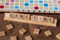 Scrabble board game with the scrabble tile spell `Game Time` Royalty Free Stock Photo