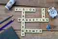 Scrabble letters with text VISION, STRATEGY, MARKETING, PLAN and GROWTH