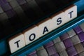 a scrabble word which spell toast Royalty Free Stock Photo