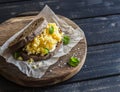 Scramble egg sandwich on rustic wooden background. Royalty Free Stock Photo