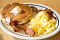 Scramble eggs, hot cakes and bacon Royalty Free Stock Photo