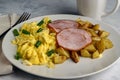 scramble eggs ith canadian bacon and home fries Royalty Free Stock Photo