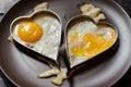 Scrambled couple eggs in hearts. Love theme.