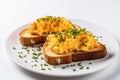 Scrambled Egg Toast on a Plate Isolated on a White Background, created by Generative AI Royalty Free Stock Photo