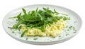 Scrambled eggs with arugula on white plate isolated on white background, top view. Healthy breakfast - fluffy scrambled Royalty Free Stock Photo