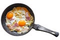 Scrambled eggs with bacon and onions in an old frying pan Royalty Free Stock Photo