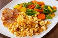 Scrambled eggs with bacon and vegetables mix Royalty Free Stock Photo