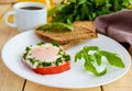 Scrambled eggs, baked in a ring bell pepper, toast, arugula leaves and a cup of coffee. Light breakfast. Royalty Free Stock Photo
