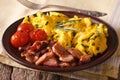 Scrambled eggs and chives, fried bacon close-up. horizontal Royalty Free Stock Photo