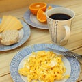 Scrambled eggs, coffee, breakfast on the wooden table Royalty Free Stock Photo