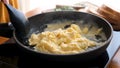 Scrambled eggs in cooking pan