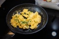Scrambled eggs in cooking pan. Process of cooking scrambled eggs Royalty Free Stock Photo