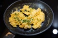 Scrambled eggs in cooking pan. Process of cooking scrambled eggs Royalty Free Stock Photo