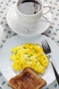 Scrambled eggs, cup of coffee and toast. Royalty Free Stock Photo