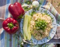 Scrambled eggs decorated with fresh paprikas, cucumber and onion Royalty Free Stock Photo