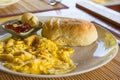 Scrambled eggs on dish with bread jam and butter Royalty Free Stock Photo