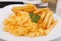 Scrambled eggs with french fries