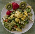 Scrambled eggs with fruits and vegetables Royalty Free Stock Photo