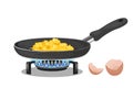 Scrambled eggs in frying pan on gas stove isolated