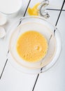 Scrambled eggs in a glass bowl with glass of milk. Royalty Free Stock Photo