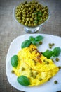 Scrambled eggs with green peas Royalty Free Stock Photo