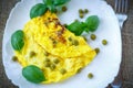 Scrambled eggs with green peas Royalty Free Stock Photo