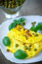 Scrambled eggs with green peas Royalty Free Stock Photo