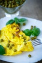 Scrambled eggs with green peas Royalty Free Stock Photo