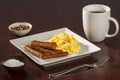 Scrambled Eggs and Link Sausages with Coffee Askew