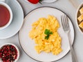 Scrambled eggs, Omelette. Breakfast with pan-fried eggs, cup of Royalty Free Stock Photo