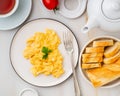 Scrambled eggs, Omelette. Breakfast with pan-fried eggs, cup of